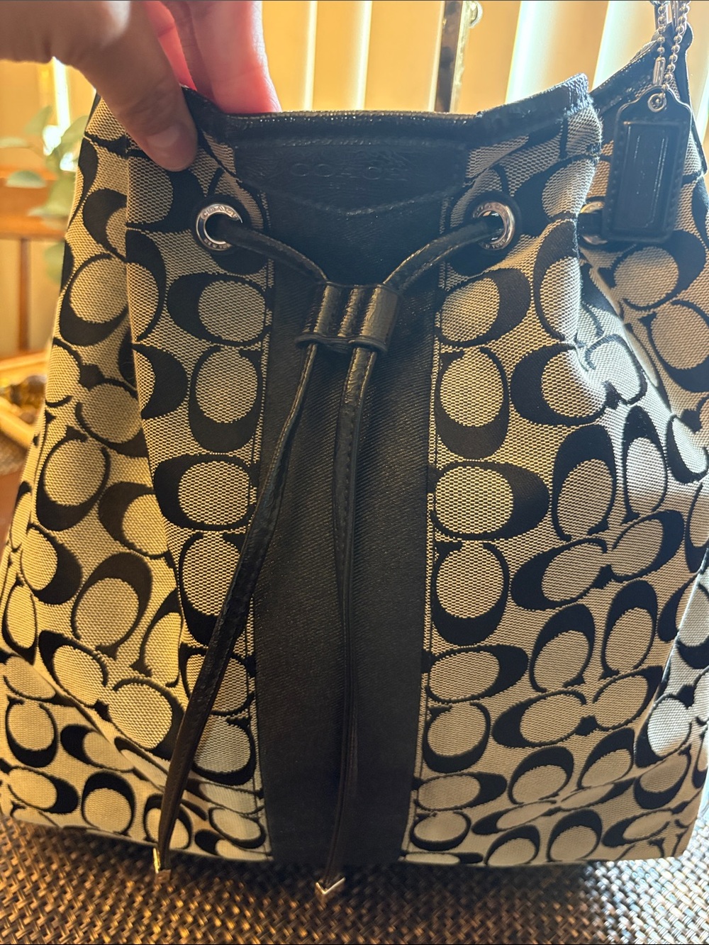 Coach black CC large drawstring bucket shoulder bag with silver tone hardware .